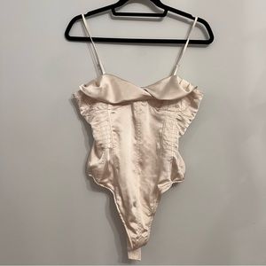 peachy white silky body suit with buttons and adjustable straps size medium